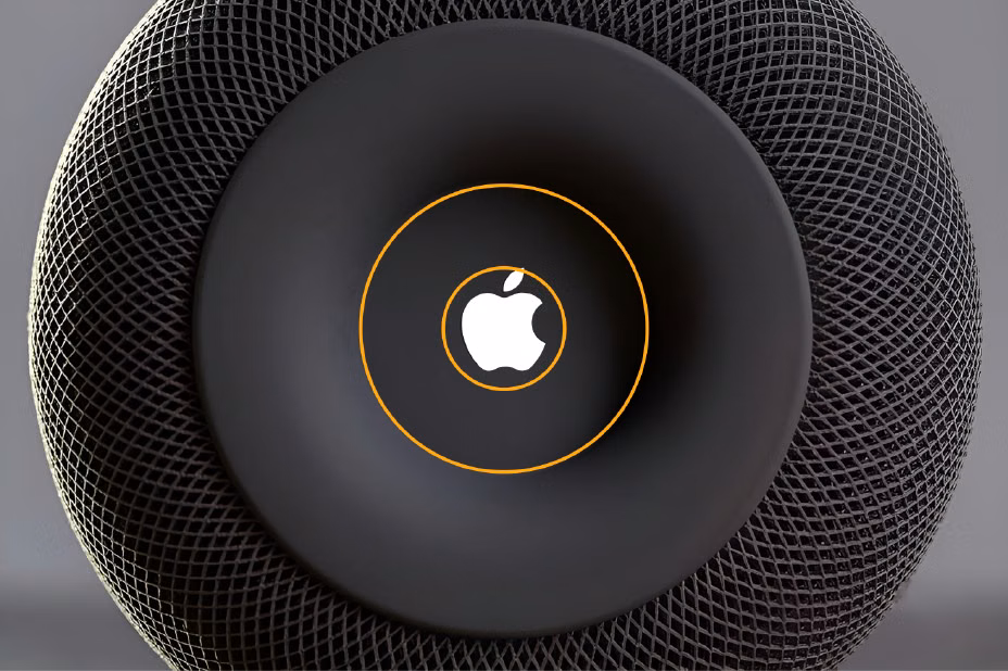 Apple logo on the HomePod with orange guides showing its mass placed close to the center surface